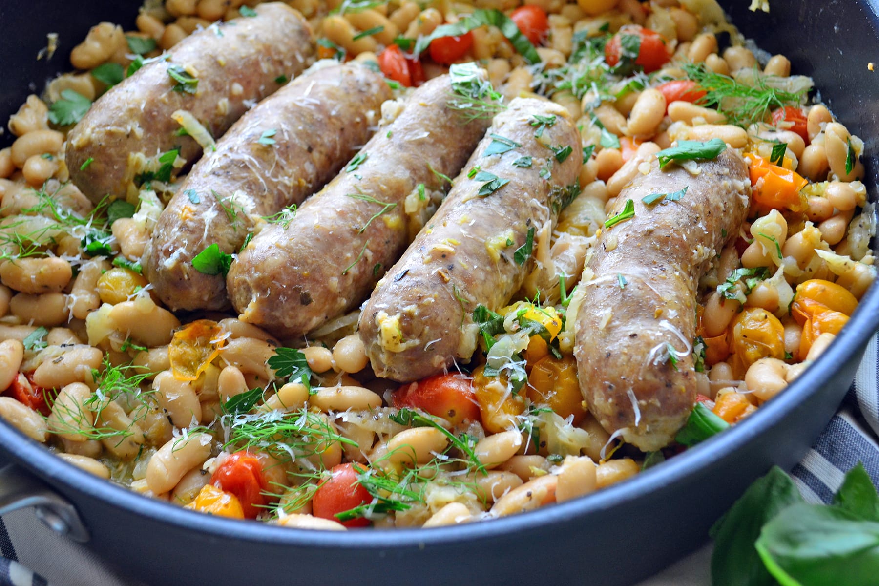 https://food-fanatic-res.cloudinary.com/iu/s--0FqXtdRz--/f_auto,q_auto/v1468248368/italian-sausage-and-white-beans-skillet-photo