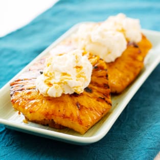 Grilled pineapple with mascarpone whipped cream photo