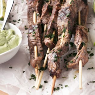 Grilled cilantro lime beef skewers with jalapeno avocado dipping