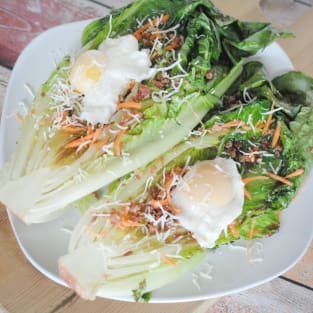 Grilled romaine with poached eggs photo