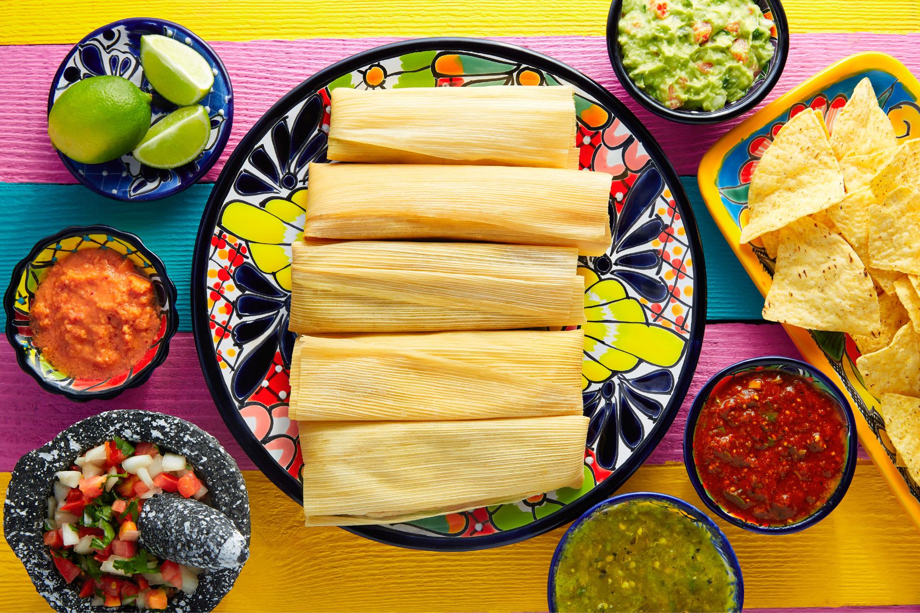 https://food-fanatic-res.cloudinary.com/iu/s--cN9GuSo9--/f_auto,q_auto/v1694024250/how-to-cook-tamales-in-the-oven-photo