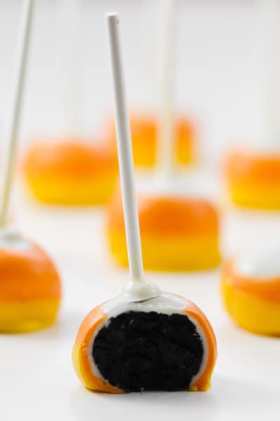 Candy Corn Oreo Pops are a simple no-bake treat that are a hit with any crowd. Super easy to make with perfect Candy Corn layers!