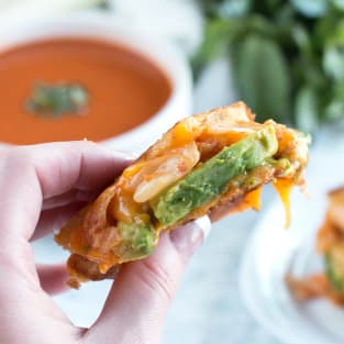 Avocado kimchi grilled cheese with thai spiced tomato soup photo