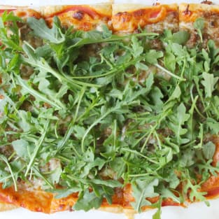 Puff pastry sausage and arugula pizza photo
