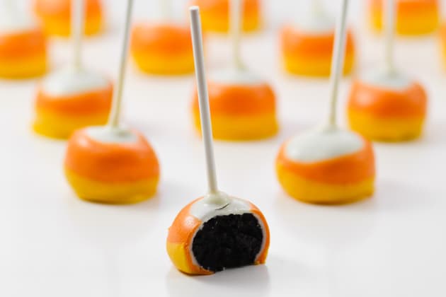 Candy Corn Oreo Pops are a simple no-bake treat that are a hit with any crowd. Super easy to make with perfect Candy Corn layers!