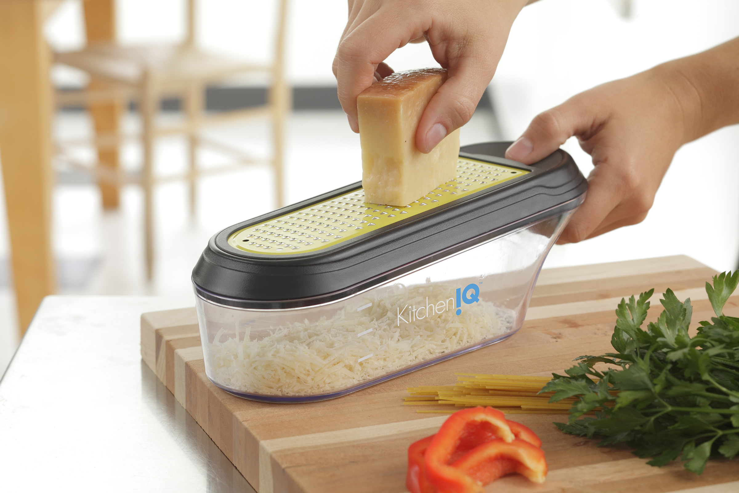 https://food-fanatic-res.cloudinary.com/iu/v1393677715/product/kitcheniq-v-etched-container-grater.jpg